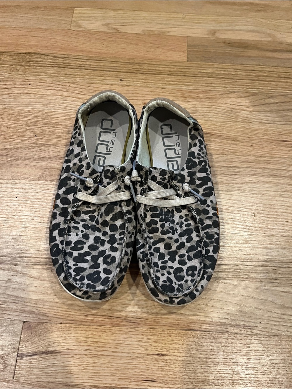 Hey Dude Women Slip-Ons in Black and Cream Cheetah Print